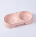 Pink plastic double pet bowl detail view, macaron color cat feeding basin, durable pet supplies. - Pink