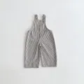 Detailed view of black and white striped baby overalls with cute front pocket and shoulder buttons. - 80cm / Striped
