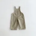 Detailed view of khaki children overalls, featuring front pocket and adjustable shoulder straps. - 80cm / Khaki