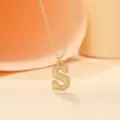 Gold-toned initial letter S pendant necklace, elegant minimalist fashion jewelry accessory. - Letter S