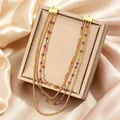 Elegante collar de cadena dorada en capas con vibrantes cuentas multicolores en joyero - Collar Multicapa Cuentas de Colores (N-49G)