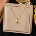 Elegant gold necklace with a sparkling floral clover pendant displayed on a beige gift box - White Zirconia Four Leaf Clover Necklace(H1032)