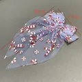 Festive Christmas mesh bow hair clip featuring red candy cane prints, measuring 30cm by 17cm - Christmas Candy Cane Duckbill Clip