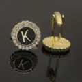 Gold-tone alphabet K cufflinks featuring black enamel center and sparkling rhinestone halo. - B1396-K Cufflinks