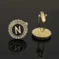 Gold-tone metal letter N rhinestone cufflinks with black enamel palace style design. - B1396-N Cufflinks