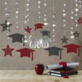 Graduation party hanging decoration detail featuring sparkling stars, caps, and silver letters. - 13 Pieces/Pack / Red & Black Graduation Star Garlands