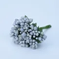 Close-up detail of silver artificial berries and pearl beads for DIY crafts and decor. - Silver