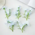 Lichtblauwe kunstmatige kleine orchideeën voor DIY haaraccessoires en gezellige huisdecoratie. - Blauw