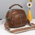 Braune, mehrfache weiche Damen-Umhängetasche mit breitem Gurt und modischem Kuppel-Design. - Braun