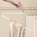 Z-shaped stainless steel pants hanger with non-slip coating for wardrobe space saving. - White