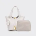Grey PU leather bucket bag detail view with chevron pouch, golden lock and pebble texture. - White
