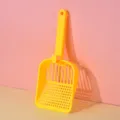Paletta per gatti in plastica gialla con fori grandi, strumento pratico per la pulizia quotidiana. - Giallo