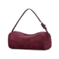 Burgundy suede cylinder shoulder bag, minimalist chic aesthetic handbag with slender strap. - Velvet Wine Red
