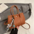 Chic minimalist brown faux leather tote bag with crossbody strap and cute charms commuter. - L / Brown
