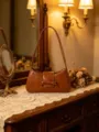 Brown leather shoulder bag for women, stylish baguette handbag with chic bow accent, chic commute. - Khaki
