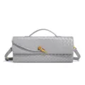 Detailed view of the stylish grey woven leather baguette bag showing fine intrecciato craftsmanship. - Agate Grey