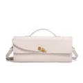 Detail view of a chic beige woven leather shoulder bag featuring a stylish gold knot closure. - Off White