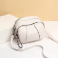 White soft leather crossbody bag, stylish double zipper small shoulder bag with rivet strap variant. - White