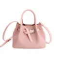 Bolso de cubo de cuero rosa con asa superior y elegante cinturon nudo para mujeres. - Rosa