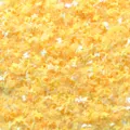Close-up detail of bulk yellow butterfly sequins for nail art, crafts and DIY projects. - 30g/Pack / Iridescent Plated Yellow Butterfly