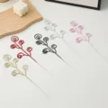 Close-up of colorful glitter spiral branch decorations, sparkling Christmas tree and wreath accessories. - Candy Circle / Pink
