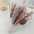 Detailed close-up of colorful glitter berry branches in white wire basket, perfect for Christmas decor. - 12-Fork Glitter Ball Branch / White