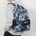 Casual blue camo backpack variant featuring a stylish front pocket and spacious storage design. - Blue