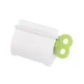 Distributeur de dentifrice en plastique blanc avec clé rotative verte pour tubes de crème. - Vert