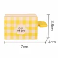 Cartoon yellow checkered manual toothpaste squeezer, creative lazy rolling tube clip. - Lemon Scented Square Cake
