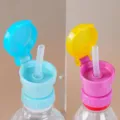 Mineral water bottle cap with straw adapter, portable anti-choking kids cup lid accessory. - Pink