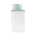 Contenant de stockage en plastique transparent avec couvercle vert et tasse de mesure. - Emballage en vrac / Vert