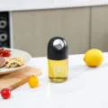 Bottiglia d'olio in vetro automatica da cucina, dispenser di condimenti a goccia. - 210ml / Nero