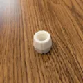 White 3D printed toothpaste dispenser adapter variant, durable plastic threaded connector. - White