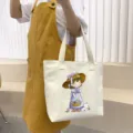 Large capacity canvas tote bag with cute cartoon girl illustration, casual daily shoulder bag. - Pretty Bitch / Beige