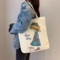 Large capacity canvas tote bag for women, cute cartoon girl print casual shoulder handbag. - Straw Hat Girl