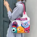 Cute cartoon monster canvas tote bag, large capacity shoulder vest bag for student daily commute. - Colorful Monster
