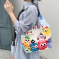Cute cartoon monster canvas shoulder bag for women, large capacity casual commuter tote handbag. - Cute Monster Carnival