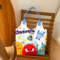 Cartoon monster canvas tote bag, large capacity shoulder bag for women and students. - Cute Monsters