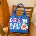 Blue canvas tote bag with cute bear graphic and letter print, large capacity casual shoulder bag. - Lucky Bear