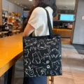 Casual black canvas tote bag with cute white cat doodles for women daily commute use. - No Zipper No Inner Pocket Double Sided Print / MIMI Cat - Black