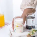 Clear glass cup with cute floral design, ideal for milk, yogurt, and breakfast drinks. - Garden Cup (Tall Style)