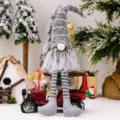 Christmas gnome plush toy with striped knitted hat and hanging legs for holiday home decor. - Gray