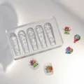 Clear silicone nail art mold featuring 3D unicorn and hot air balloon designs for DIY manicure. - Mj-032