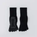 Black cotton five-toe non-slip yoga socks with grip dots for pilates and fitness workouts. - One Size / Black