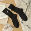 Μαύρες ριμπ χειμερινές κάλτσες από μαλλί για γυναίκες με κέντημα φιόγκο, ζεστές και άνετες. - Ένα μέγεθος / Μαύρο
