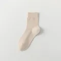 Men's solid beige mid-tube cotton casual socks, comfortable everyday knit wear style. - One Size / Beige