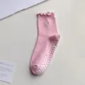 Pink yoga grip socks with ruffles, cute heart embroidery, and anti-slip silicone dots for floor. - One Size / Pink