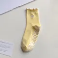 Yellow anti-slip yoga socks with cute heart embroidery, ruffled cuff and grip soles. - One Size / Yellow
