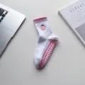White yoga socks with cute pink peach embroidery and anti-slip heart grips for pilates and fitness. - Fruit-Peach
