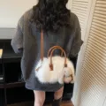 White fluffy faux fur Boston bag with brown handles and a cute plush bunny charm - Style With Pendant / White + Pendant